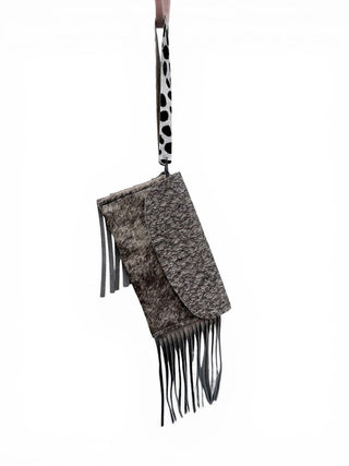 Embossed fringed cowhide wristlet