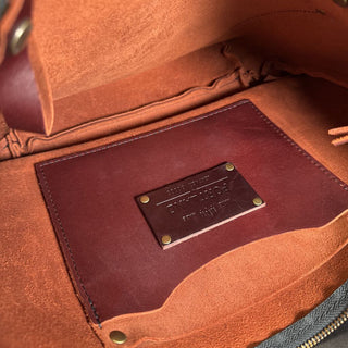 Zip top leather shoulder bag